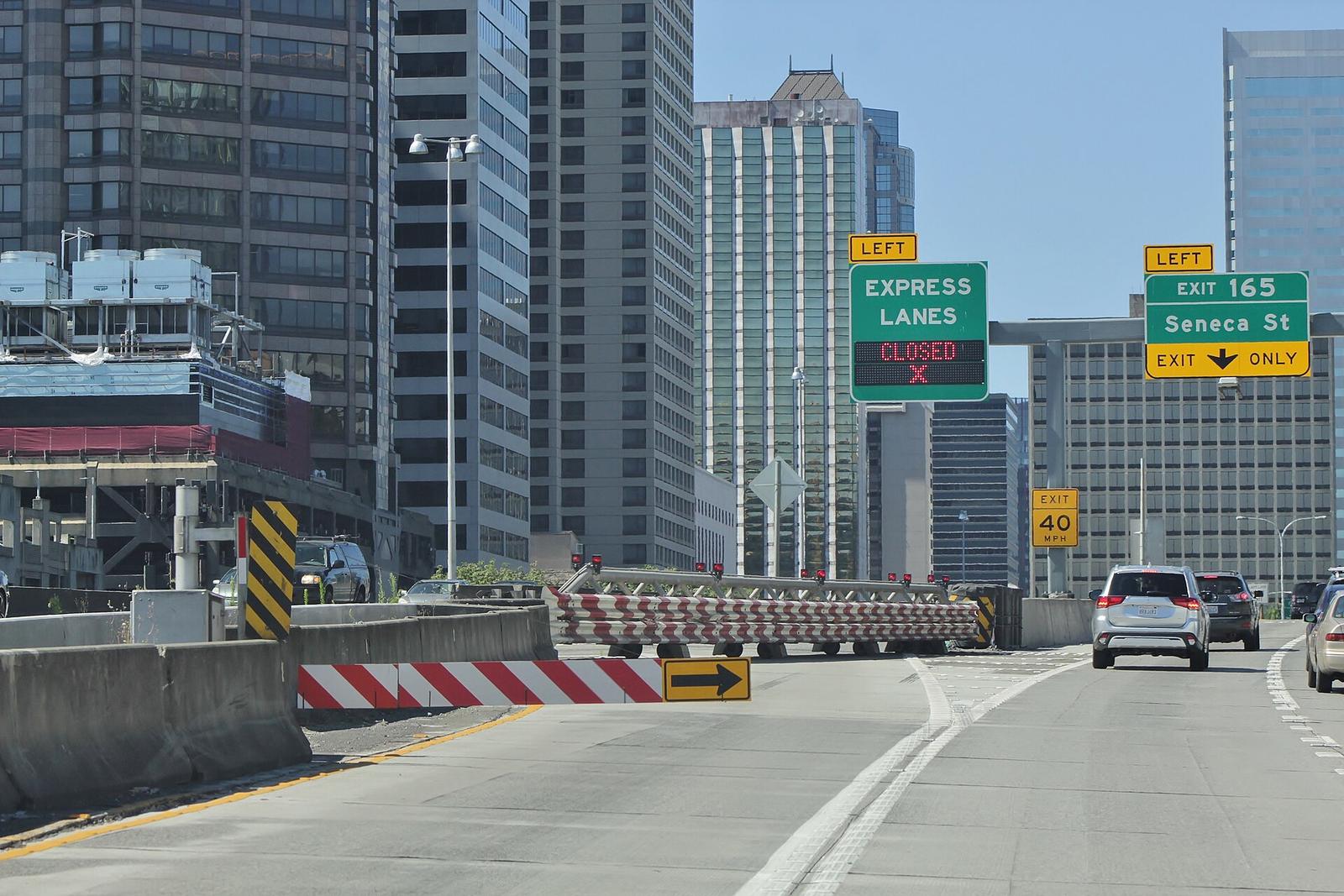 The northbound I-5 express lanes entrance at Seneca Street, closed, with downtown towers around it