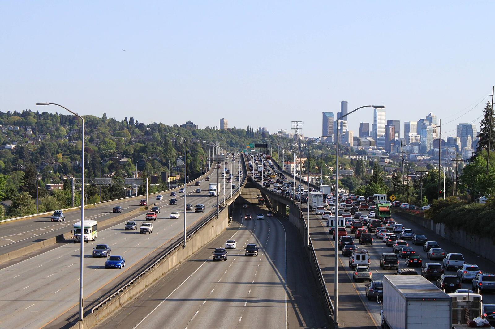 Southbound I-5 traffic seen from the NE 45th Street overpass, with downtown behind